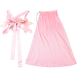 Detail of pink satin two-piece set featuring oversized lace flower and elegant long ribbons
