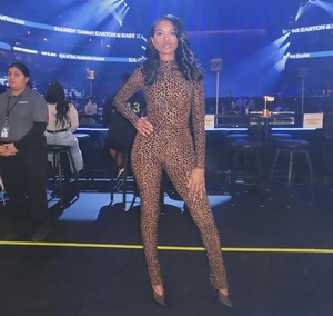 Macro detail of the leopard print pattern on high-neck slim-fit long-sleeve bodysuit