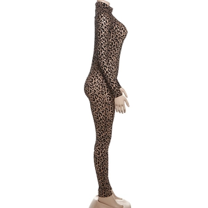 Detail shot of leopard print jumpsuit featuring long sleeves and a mock neckline