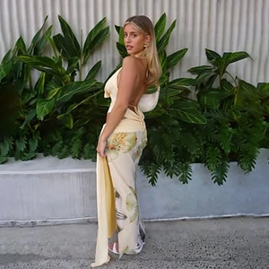Detail of sexy backless halter top with floral print maxi skirt in resort style