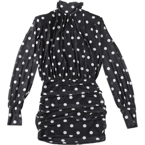Detail of ruched polka dot mini dress with high neck and long sleeves on white background
