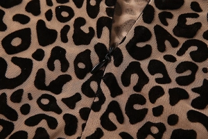 Close-up of leopard print mesh fabric with high-quality concealed zipper detail