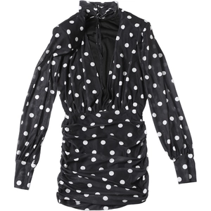 Detail of ruched texture and polka dot print on high neck long sleeve mini dress