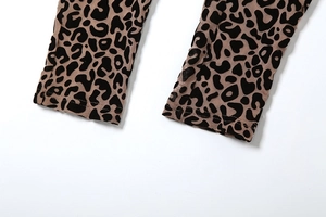 Close-up of leopard print sleeve cuffs with professional stitching on khaki fabric