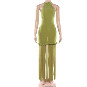 Detailed view of green halter mini dress featuring fringe hem and braided waist accents