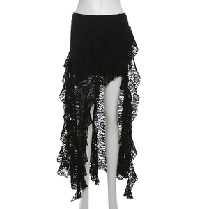 Detailed close-up of intricate floral lace texture and layered ruffle hemline of the skirt