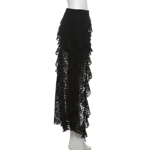 Detailed view of black lace skirt featuring asymmetrical tiered ruffles and intricate patterns