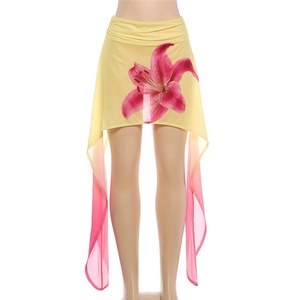 Detail of floral chiffon mini skirt with pink lily print and irregular fringe tassels