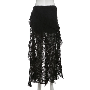 Detail of black lace mini skirt with layered ruffles and asymmetric hem on mannequin