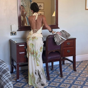 Detail of floral backless halter top and matching maxi skirt set in an elegant interior