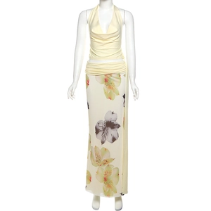 Detail of light yellow halter neck top and high waist floral print maxi skirt set