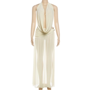 Detail of the plunging cowl neck and sheer mesh beige fabric on the halter maxi dress