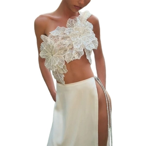 White two-piece set with floral embroidery crop top and high slit skirt with metal chains