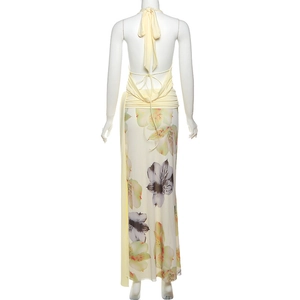 Detailed back view of sexy backless halter top and floral printed long skirt set