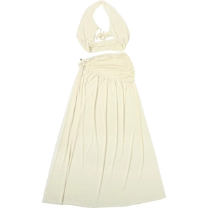 Detail of ivory two-piece set featuring halter neck top and side ruched maxi skirt