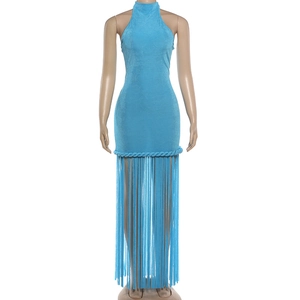 Detail of sky blue halter dress with intricate rope knit accents and long fringe tassels