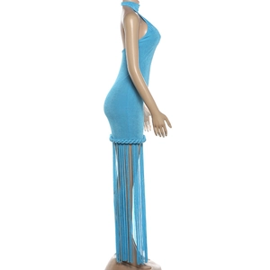 Detail view of the bright blue halter dress featuring long hanging fringe tassels