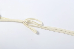 Detail view of high-quality adjustable cream yellow knit straps with a loose knot detail