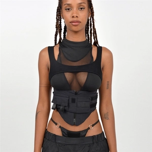Close-up of black techwear vest with functional utility pockets and mesh stitching