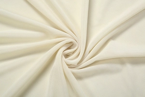 Macro detail of breathable off-white mesh fabric with pleated texture and draping