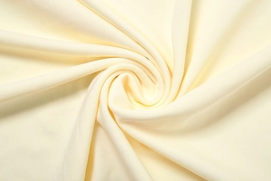 Close-up of the soft cream yellow ribbed fabric texture on this stylish three-piece set
