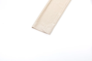 Close-up detail of champagne gold silky fabric sleeve cuff with smooth texture and sheen