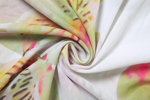 Detailed macro view of soft pink floral mesh fabric with a breathable knit structure
