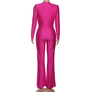 Rear view of fuchsia long sleeve jumpsuit with slim fit and stylish bell-bottom legs
