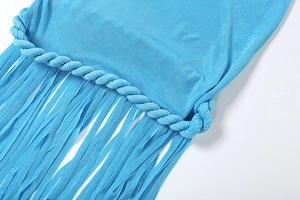 Detailed view of bright blue dress featuring hand-woven braids and long fringe hemline