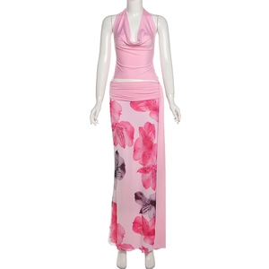 Detail of floral print maxi skirt and halter top set with side drawstring ruched hem