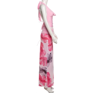 Side view of backless halter top and floral maxi skirt on mannequin on white background
