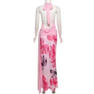 Detailed back view of a pink floral halter maxi dress with an open back and silk ribbon bow