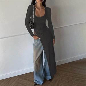 Detailed view of dark grey slim fit knit top with high side slit and asymmetrical hem