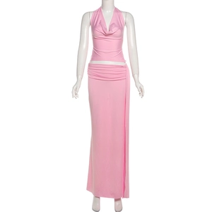 Detailed view of pink halter V-neck top and high-waist maxi skirt set for vacation