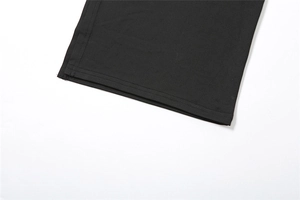 Close-up of the double-needle stitched hem on high-elastic black slim t-shirt