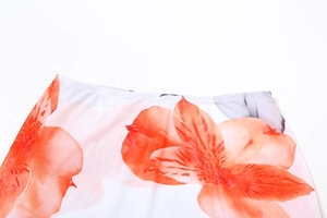 Close-up of floral print fabric with elastic waistband detail on a three-piece set