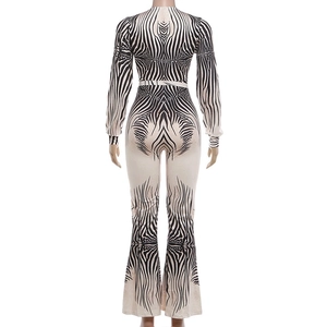 Rear view of zebra print long sleeve jumpsuit with slim fit and flared leg design