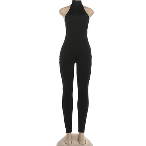 Detail showing back view of black backless halter jumpsuit with bodycon fit on mannequin