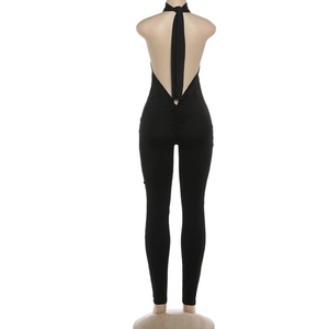 Detailed back view of a black halter jumpsuit with backless design and ruched waist detail