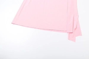 Detailed view of the light pink lightweight fabric hem with refined stitching finish