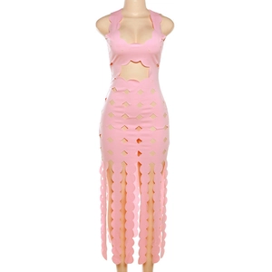 Detail of pink bodycon maxi dress featuring star cutout and scalloped laser-cut patterns