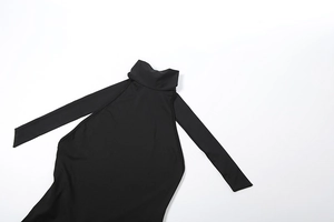 Close-up of black backless halter bodysuit showing premium elastic knit fabric texture