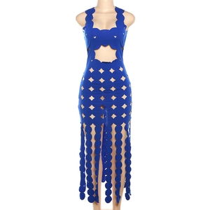 Detailed view of royal blue sleeveless dress featuring geometric cut-outs and fringe hem