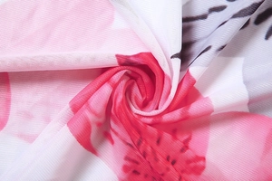 Detailed close-up of pink floral print on lightweight and breathable mesh fabric
