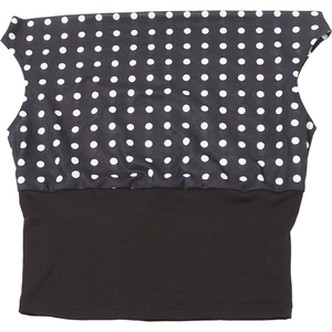 Detail showing polka dot pattern contrast and elastic waist cinching on black summer top