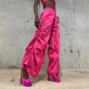 Detail of rose pink wide-leg pants with side ruching and Y2K street style aesthetic