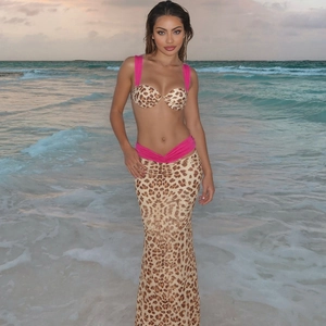 Detail of leopard print three-piece beach set with pink contrast straps and high waist skirt