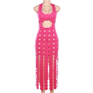 Detail of fuchsia cutout dress showing wavy halter neckline and geometric openwork