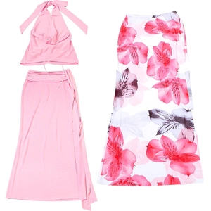 Flat lay of pink halter neck top and floral print maxi skirt 3-piece set for summer
