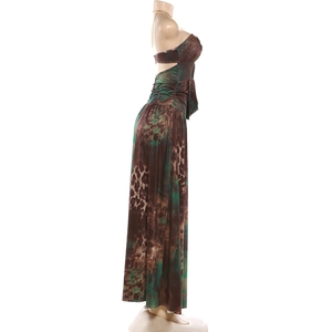 Detailed view of the gold chain halter neckline on the leopard print vacation maxi dress